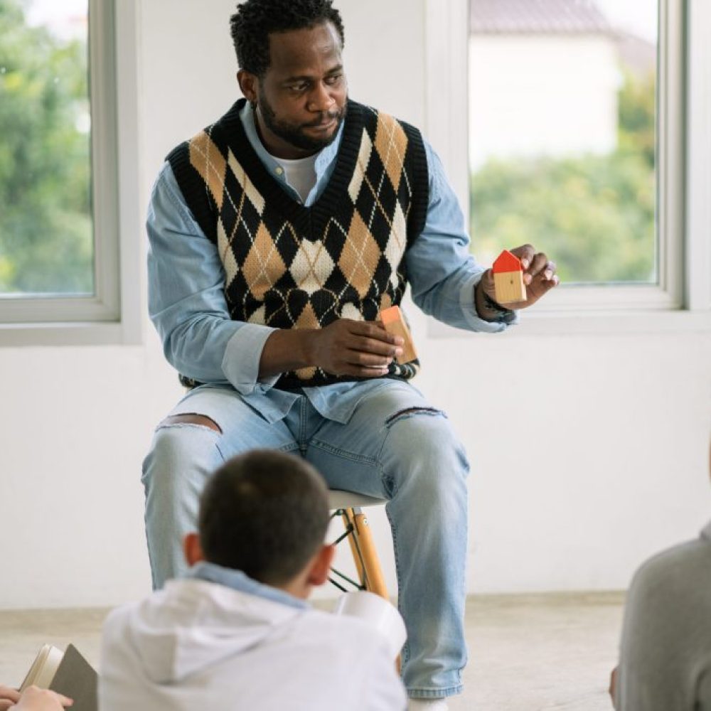 african-american-teacher-teaching-about-family-to-2025-03-05-22-49-23-utc-scaled-r8esfjsi6cjyn9vy56wski83b4fnfrluwbkl47c3tk african-american-teacher-teaching-about-family-to-2025-03-05-22-49-23-utc-scaled-r8esfjsi6cjyn9vy56wski83b4fnfrluwbkl47c3tk